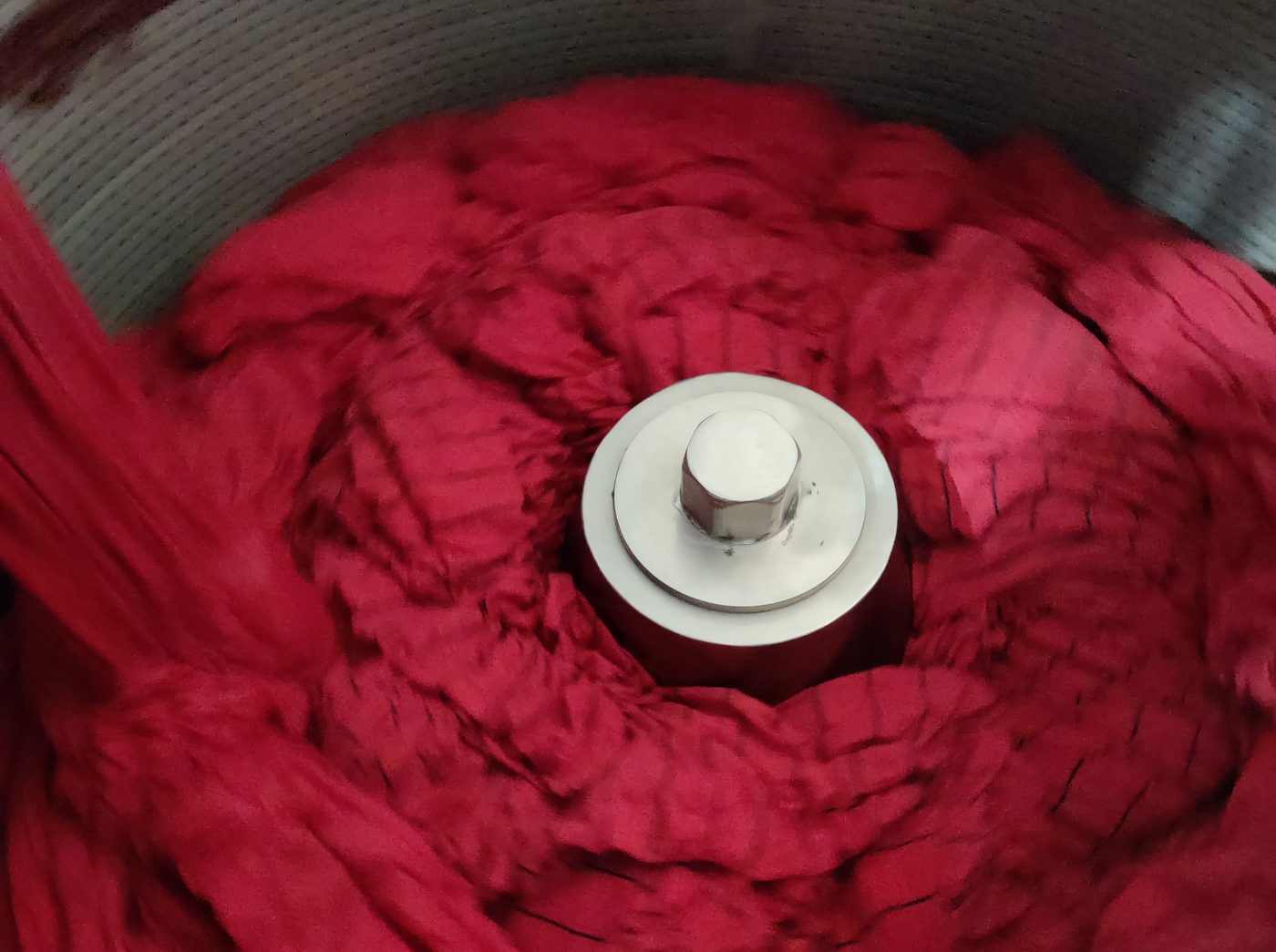 Dyed fabric rope in a stainless steel dyeing vessel
