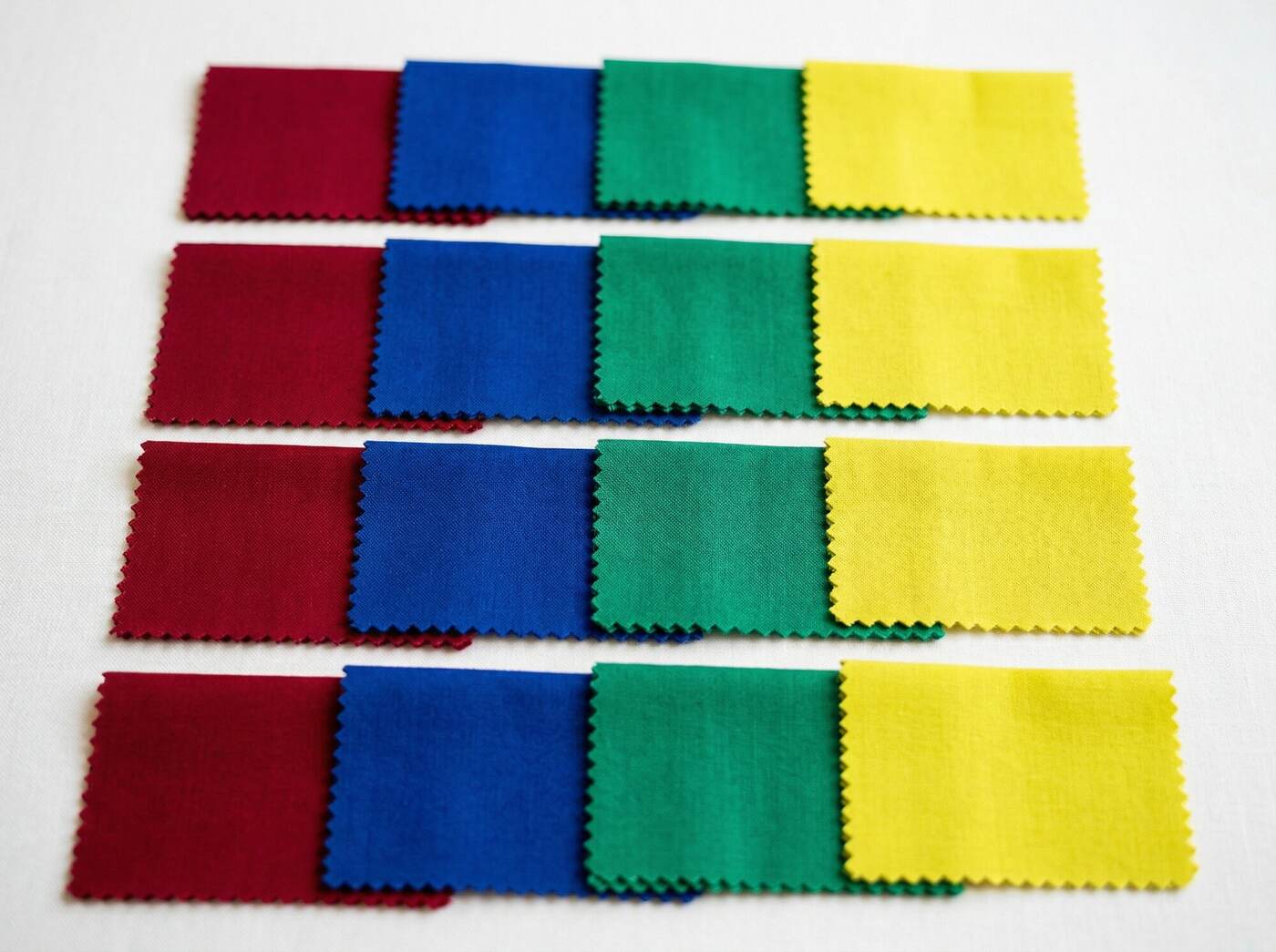 Dyed fabric swatches laid out for comparison
